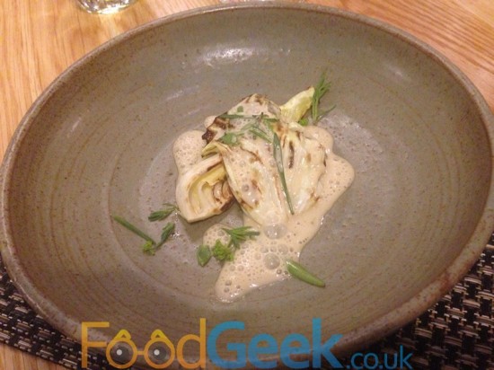 Poached oysters, charred cabbage, beer cream sea herbs